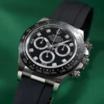 Close-up of a Rolex Oyster Perpetual Cosmograph Daytona watch with diamond markers on a black dial and stainless steel case.