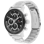 1792181-tommy-hilfiger-watch-men-black-dial-metal-stainless-steel-silver-strap-quartz-analog-rocky_2 Stainless steel chronograph watch with black dial and silver subdials, Hilfiger logo visible on face, metal bracelet