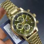 Gold-toned Tommy Hilfiger chronograph wristwatch with a green dial and three subdials on a metal link bracelet