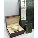 burgundy Audemars Piguet presentation box opened to reveal a beige interior and watch cushion