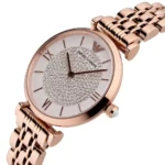 ar11244-emporio-armani-watch-women-crystals-white-dial-stainless-steel-metal-rose-gold-strap-quartz-battery-analog-gianni-t-bar_7 Round rose-gold watch with crystal-studded dial and metal link band, displaying time with Roman numeral markers (Emporio Armani).