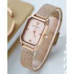 ar11347-emporio-armani-watch-square-women-rose-gold-dial-mesh-stainless-steel-metal-rose-gold-strap-quartz-battery-analog-gioia_60 Rose-gold Emporio Armani wristwatch with a rectangular face and a mesh band.