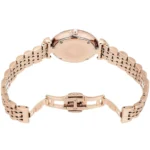 Rose gold wristwatch with linked bracelet, viewed from the back showing the case back and deployment clasp.