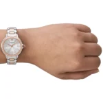 ar11643-emporio-armani-watch-women-crystals-silver-dial-metal-stainless-steel-rose-gold-strap-quartz-analog-mia_14 Two-tone metal wristwatch with a rose-gold bezel and crystal-studded dial on a wrist