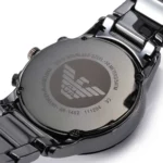 ar1452-emporio-armani-watch-men-black-ceramic-ceramica-7 Back of a polished stainless steel Emporio Armani wristwatch, with engraved brand logo and model details (AR-1452) and water resistance up to 50 meters/5 ATM
