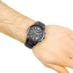 ar1452-emporio-armani-watch-men-black-ceramic-ceramica-hand-10 Black metal chronograph wristwatch on a light-arm, with multiple subdials and a date window on the face.
