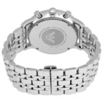 Back of a silver stainless steel wristwatch with a link bracelet, showing engravings and a circular logo on the case back."
