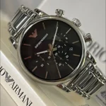 Emporio Armani stainless steel chronograph watch with black dial, silver markers, date window, and metal bracelet in a close-up.