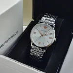 Silver Emporio Armani wristwatch with a metal link bracelet resting in a black display box.