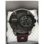 Diesel wristwatch with large dark dial and multiple subdials, brown leather strap, presented on a white perforated cushion in a display box