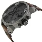 Close-up of a dark metal chronograph wristwatch with multiple subdials and a brown leather strap.