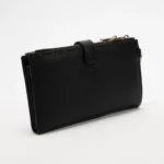 Black textured zip-around wallet with a small strap on top, photographed on a light background