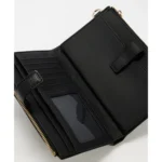Black leather wallet opened to reveal card slots and a clear ID window with a gold-zippered edge around the side.