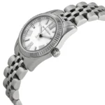 Silver Michael Kors wristwatch with a fluted bezel and metal link band, shown in close-up.