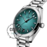 omega-seamaster-aqua-terra-150m-co-axial-master-chronometer-41-mm-automatic-terquaze-dial_2 Omega Seamaster wristwatch with teal dial, silver case and bracelet, bold triangular markers and date window, crown on the right side, watermarked image text visible.