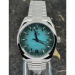 omega-seamaster-aqua-terra-150m-co-axial-master-chronometer-41-mm-automatic-terquaze-dial_6 Omega Seamaster wristwatch with a teal gradient dial, stainless steel bracelet, and date window at 6 o'clock.