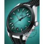 omega-seamaster-aqua-terra-150m-co-axial-master-chronometer-41mm-automatic-men_2 Close-up of teal Omega Seamaster wristwatch showing the date at 8 o'clock and bold indices on a teal dial with a textured strap.