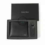 Black Calvin Klein wallet with matching key ring in a black gift box.