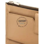 Tan leather wallet close-up showing a zipper pocket and stitched edge; circular watermark reads 'CatchyWatches.com' around a bold 'CATCHY' logo on the surface