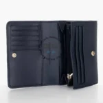 original-tommy-hilfiger-wallet-women-navy-blue-genuine-leather_8 Open navy leather wallet showing card slots on the left, a zipped coin pocket in the center, and bill compartments on the right.