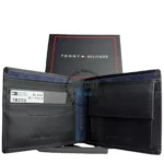 Black leather Tommy Hilfiger bi-fold wallet open to show card slots and photo of brand box in background, highlighting organization inside a compact design.
