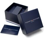 Tommy Hilfiger navy watch box with inner foam insert and matching card laid beside it.