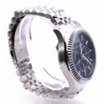 mk8280-michael-kors-watch-men-blue-dial-metal-stainless-steel-silver-strap-quartz-battery-analog-chronograph-lexington_102 Silver metal wristwatch with a blue chronograph dial and fluted bezel, photographed from the side showing the bracelet.