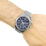 mk8280-michael-kors-watch-men-blue-dial-metal-stainless-steel-silver-strap-quartz-battery-analog-chronograph-lexington_14 Michael Kors stainless steel chronograph watch with a blue dial on a wrist