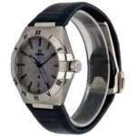 Omega Constellation stainless steel wristwatch with blue hands and markers on a dark blue leather strap, close-up view.