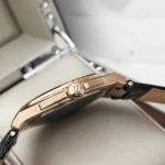 r8851153001-original-maserati-watch-men-black-dial-leather-strap_15 Close-up of a rose-gold wristwatch side, showing the crown-embellished crown at the watch winder and a black strap partially visible.