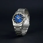 Stainless steel wristwatch with a blue textured dial, date window at 3 o'clock, and Maserati logo