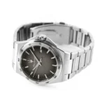 Silver stainless steel wristwatch with a black textured dial and date window on a metal link bracelet.