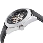 Skeleton wristwatch with visible gears, black dial, Roman numerals, and a black leather strap in a silver case