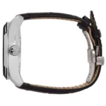 Side view of a silver wristwatch with a metal case and black leather strap.