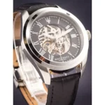 Skeleton-dial Maserati automatic wristwatch with Roman numerals and a black leather strap, exposing the gears.