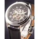 Skeleton Maserati wristwatch with visible gears, black dial, Roman numerals, and a leather strap.